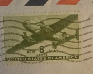 United States 1944 8 cents Transport Plane 8c Airmail stamp, photographed by a collector