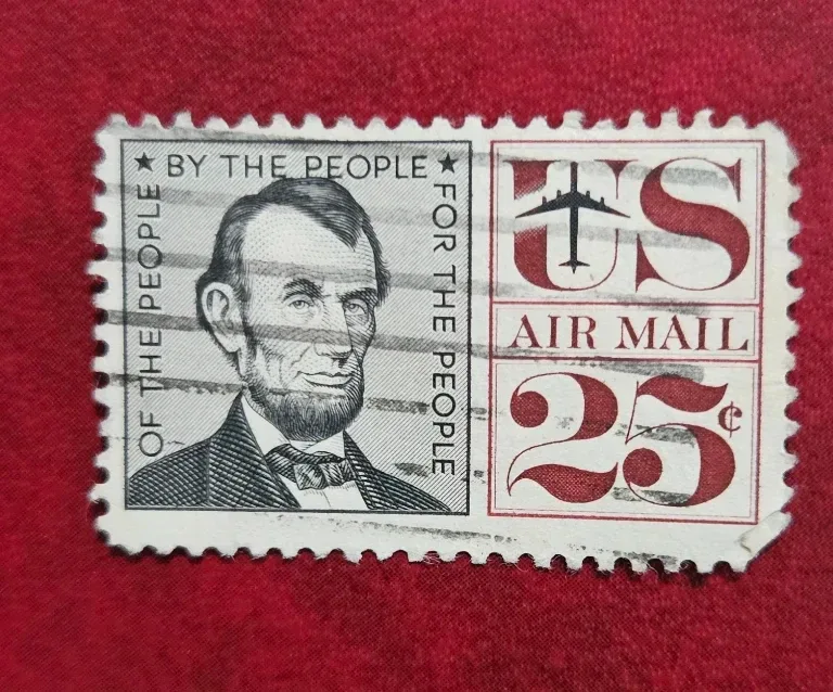 United States 1960 25c Abraham Lincoln Airmail stamp, photographed by a collector