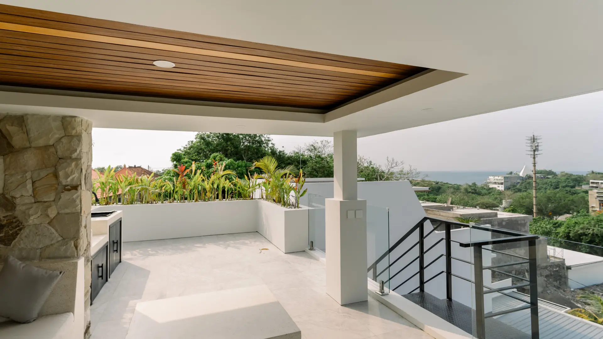 Rooftop lounge with sunken seating and panoramic ocean views - Ocean Dream Villa