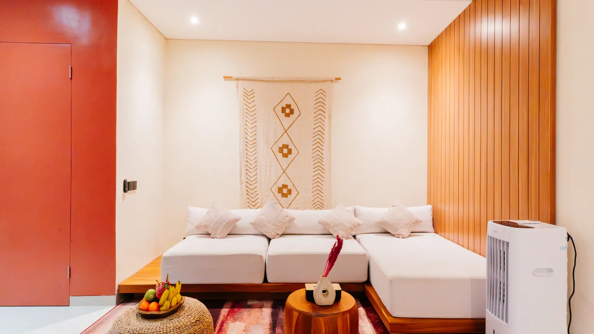 Enclosed living room with sofa, smart TV, and ceiling fan – Casa Sonya