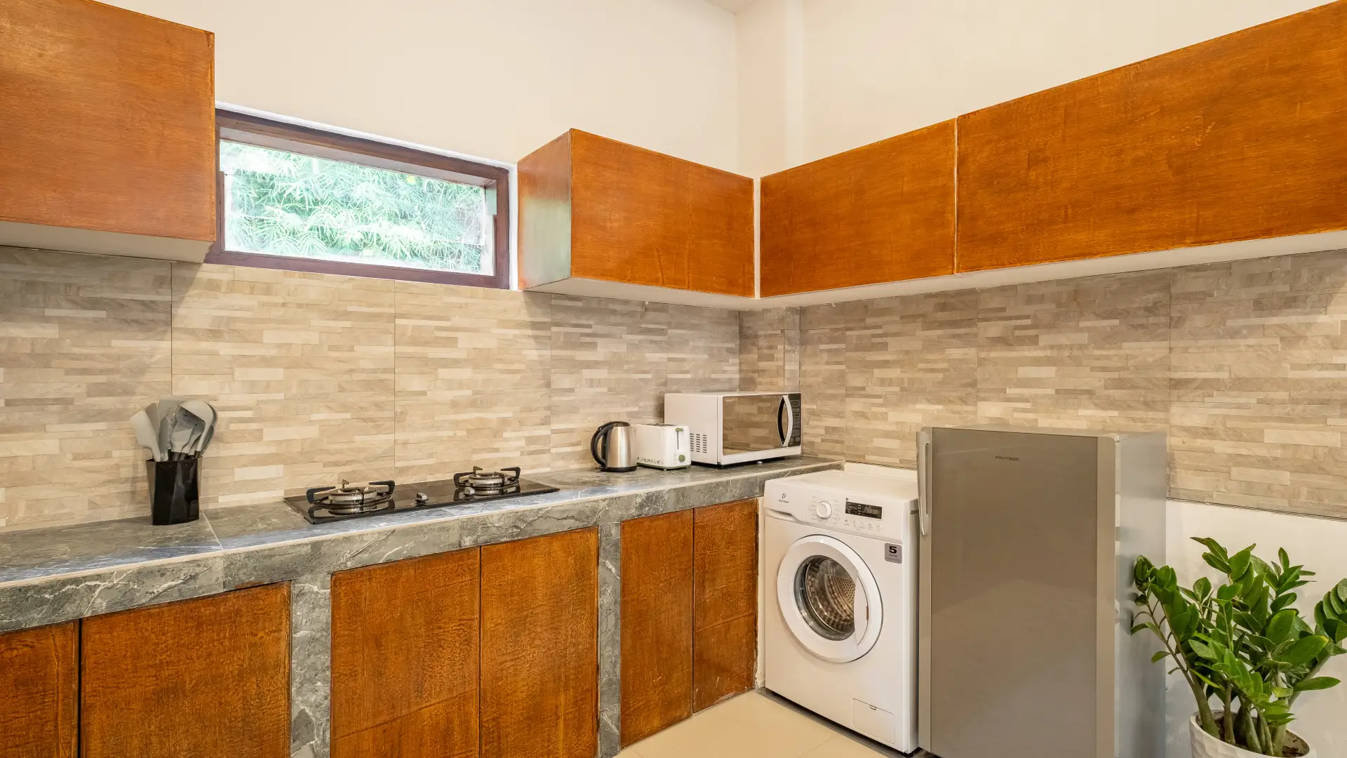 Full kitchen and breakfast bar at The Seven Residence in Kerobokan