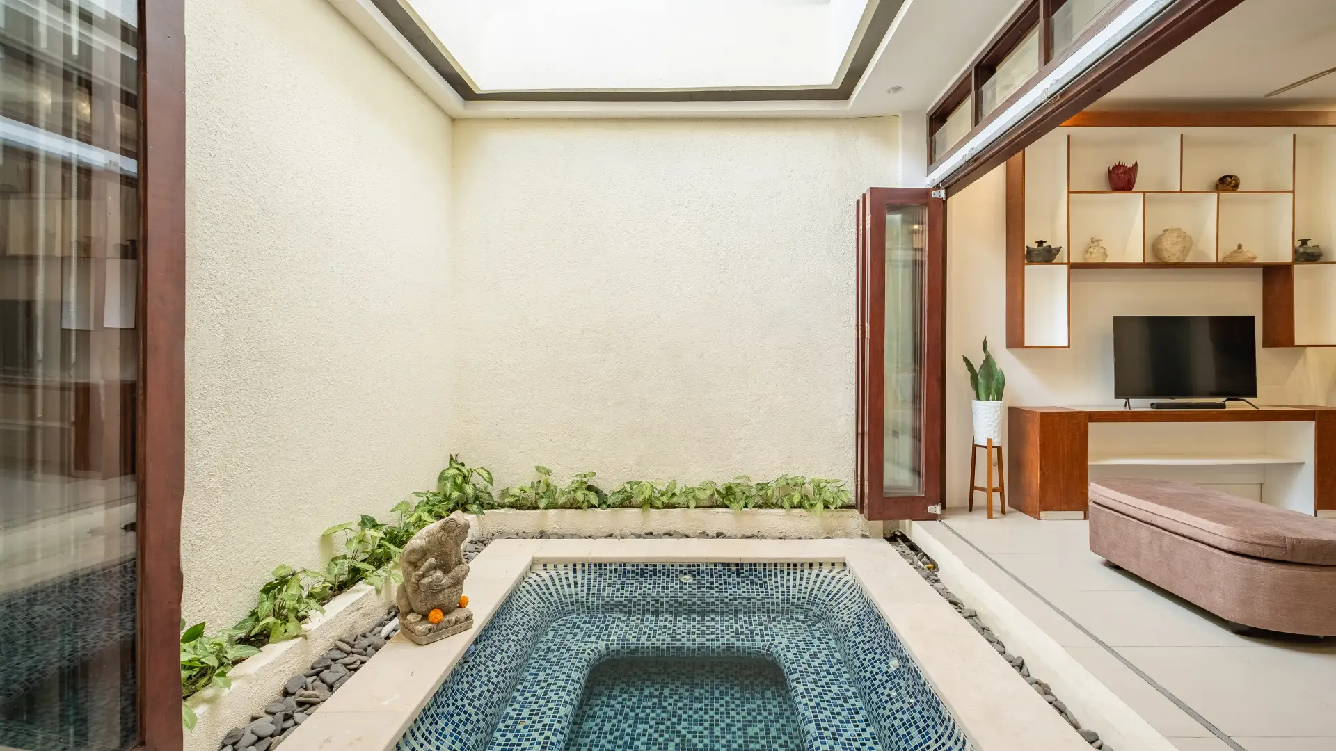 Indoor plunge pool inside the living area at The Seven Residence