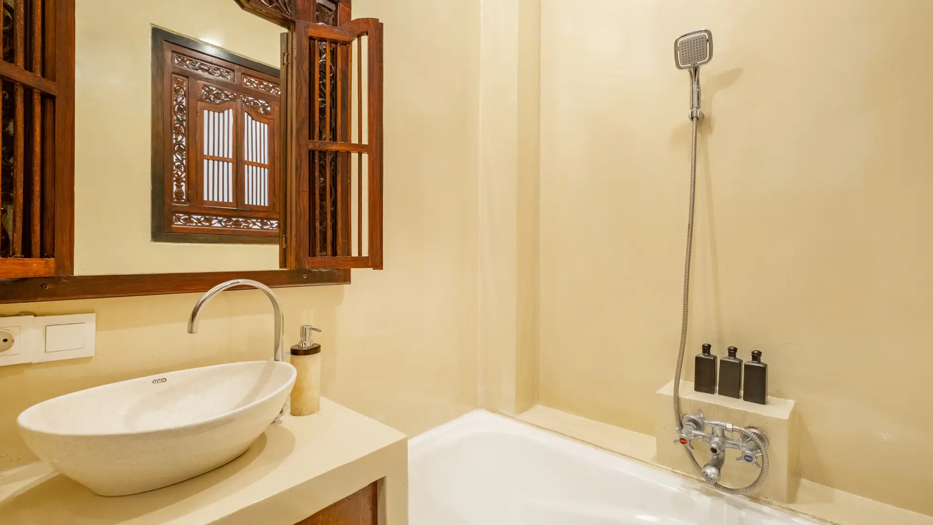Ensuite bathroom with bathtub and shower at The Seven Residence Bali