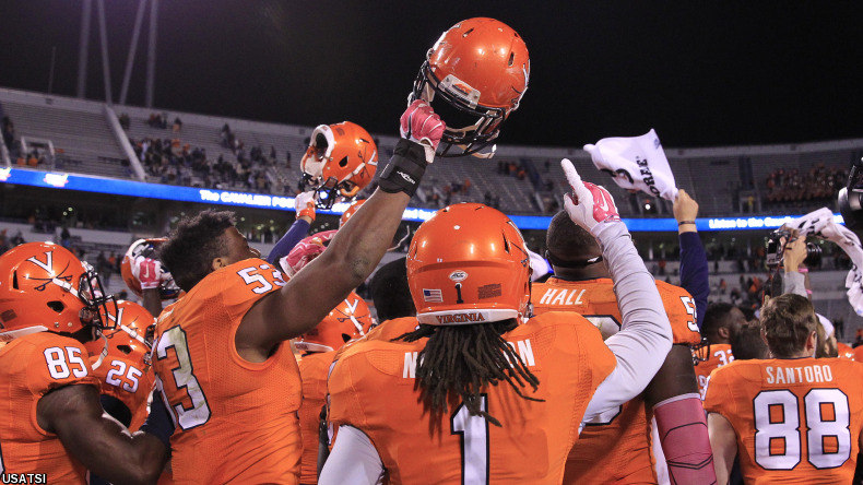 The Virginia Cavaliers players celebrate after their game against the Syracuse Orange.