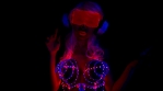 fantastic video of sexy cyber raver dancer babe filmed in fluorescent clothing under UV black light