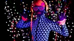 fantastic video of sexy cyber raver dancer babe filmed in fluorescent clothing under UV black light