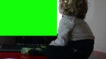 Little boy watching TV,green screen