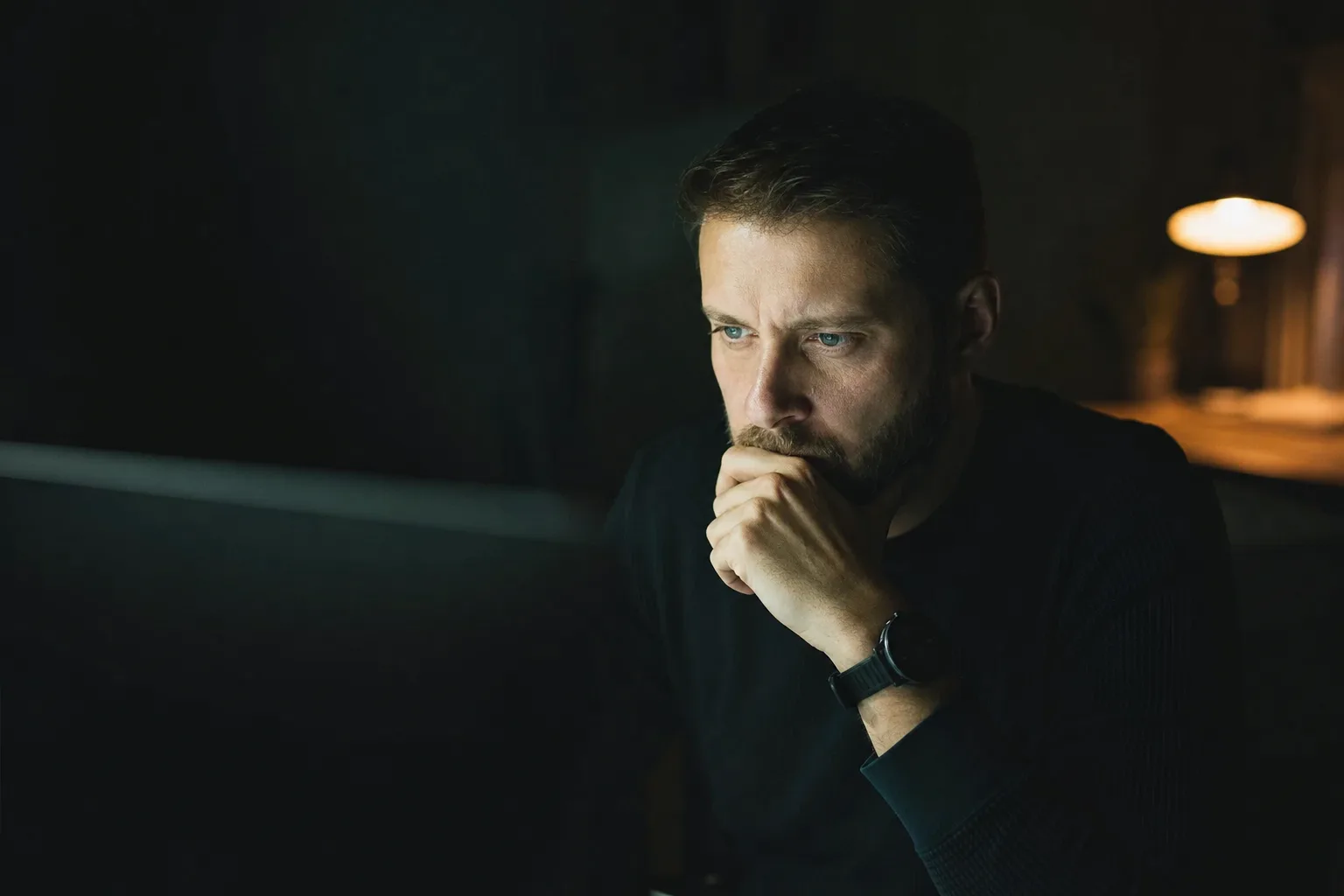 Editorial photograph: an operator reviewing machine output on screen, accompanying AI Code Review Integration for GitHub & GitLab.