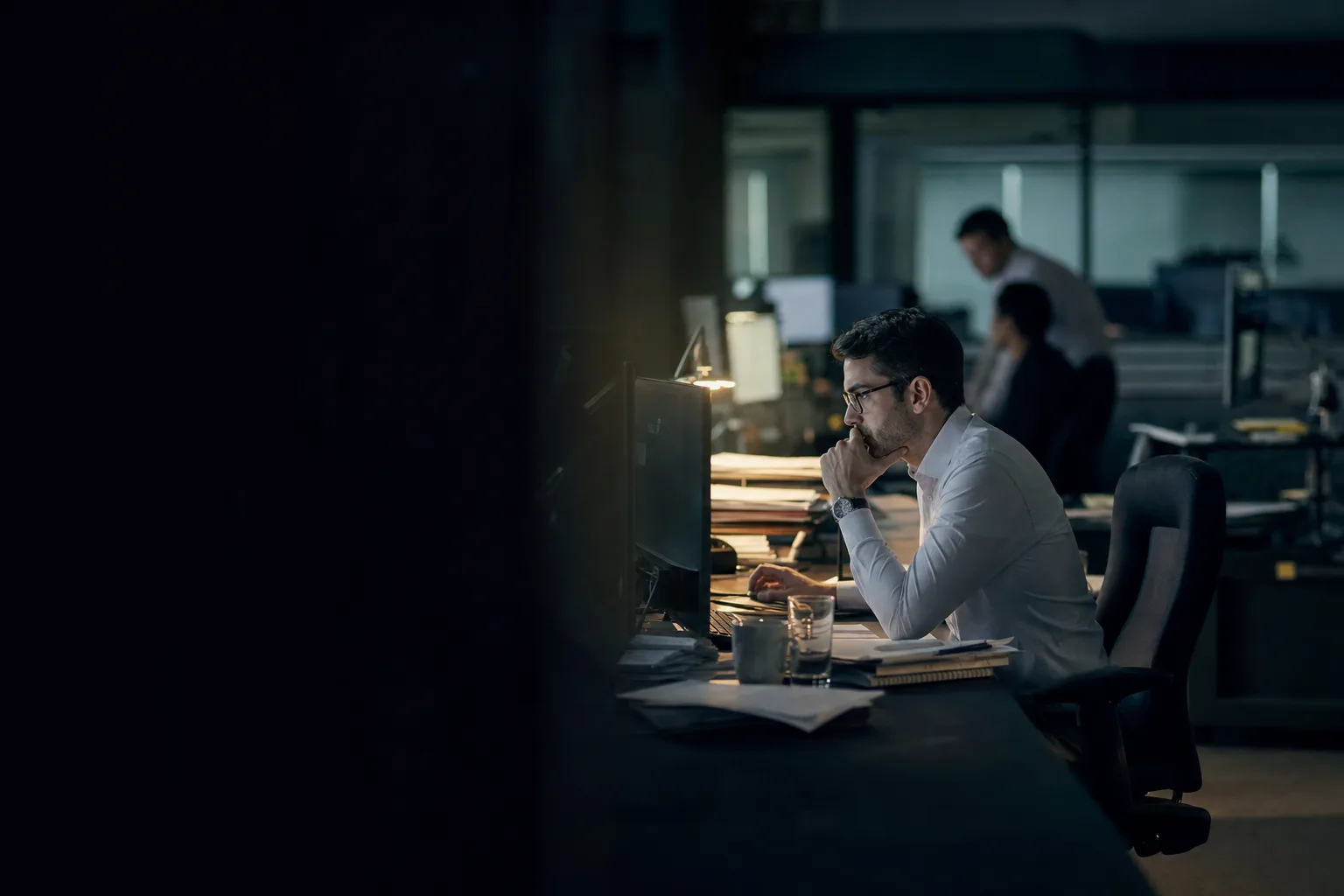 Editorial photograph: people at work on shift in the client environment, accompanying Custom Software for Financial Services.