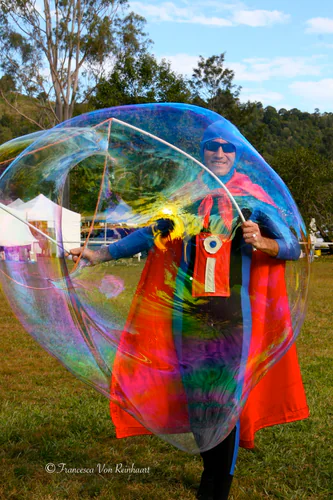 Mr Incredibubble creating giant bubbles at a public market