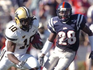 Vanderbilt's Earl Bennett is chased by Mississippi's Nate Banks in the fourth quarter. (AP Photo/Bruce Newman)