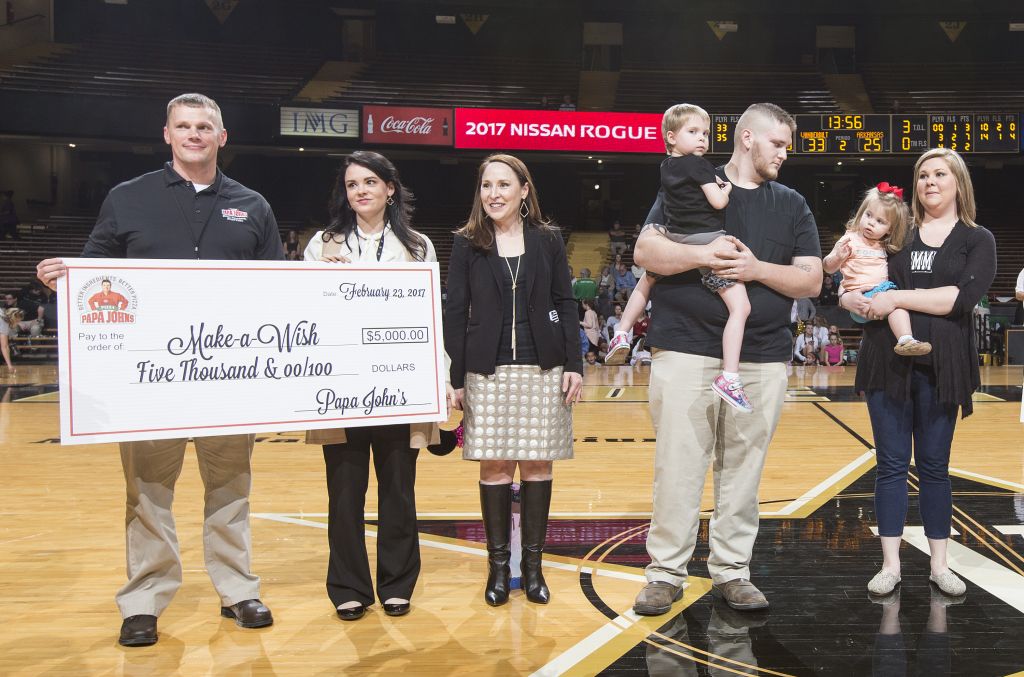 Papa John's present a check to Make-A-Wish Middle Tennessee