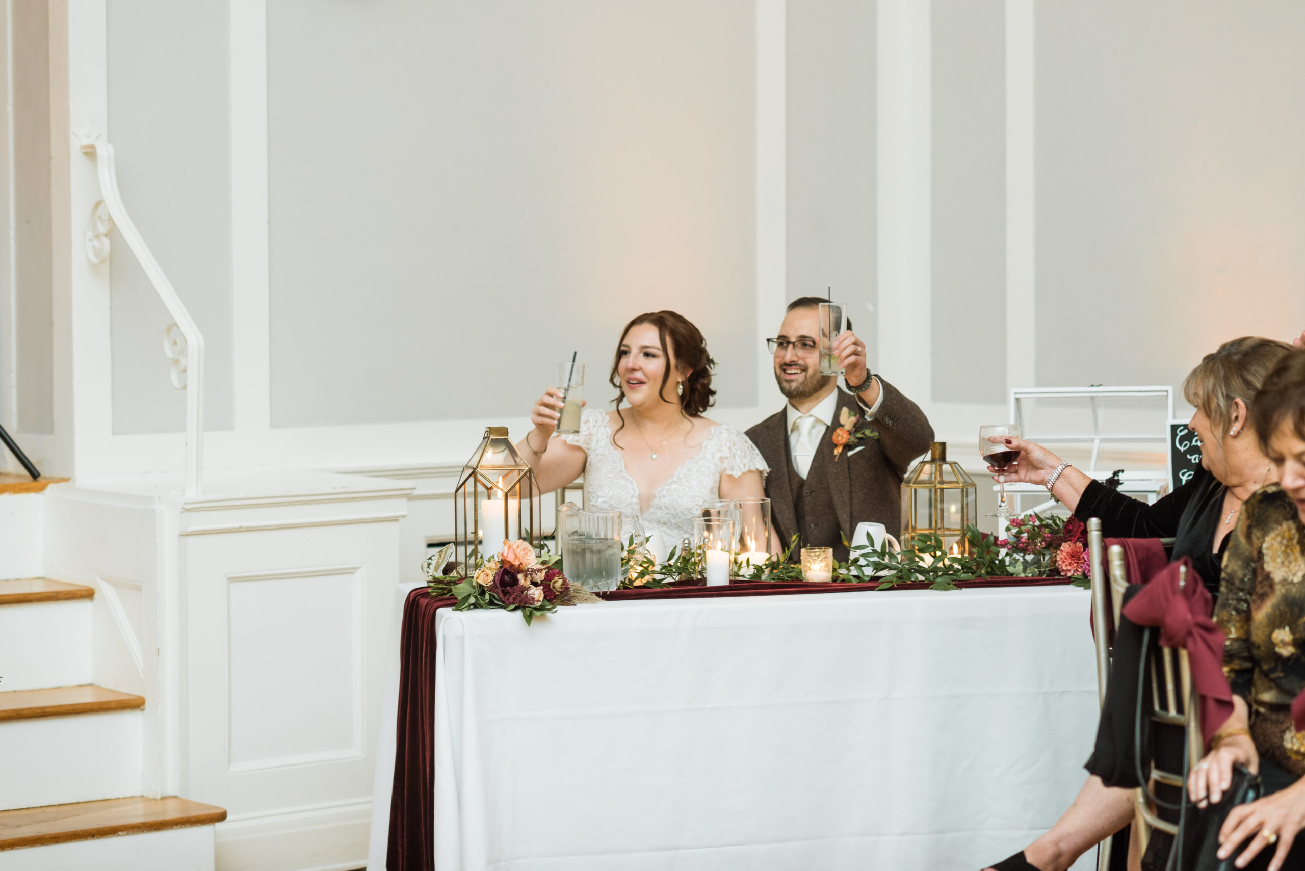 Bride and groom toasting at their sweetheart table