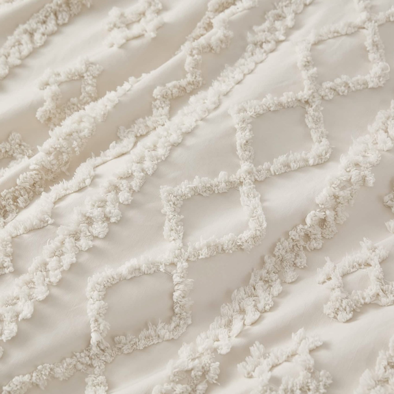 Close-up of the raised tufted embroidery texture