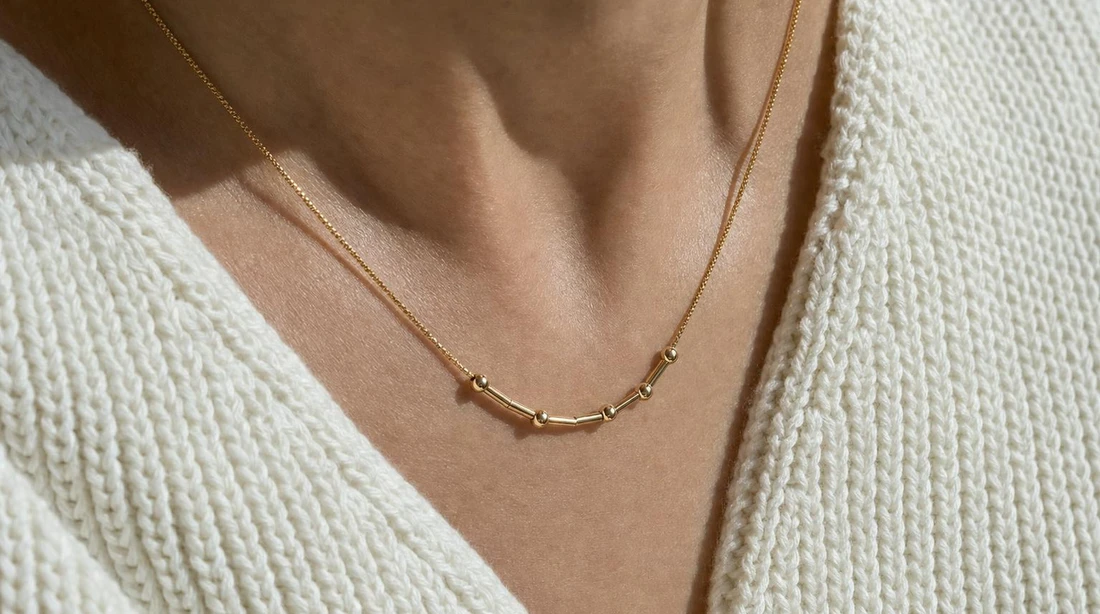 Tulas Morse Code Necklace worn everyday, close up an airport