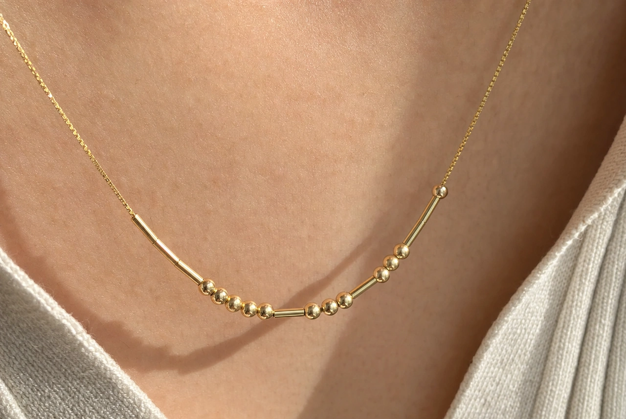 The Morse code necklaces we tested, lined up for comparison, including the Tulas Morse Code Necklace