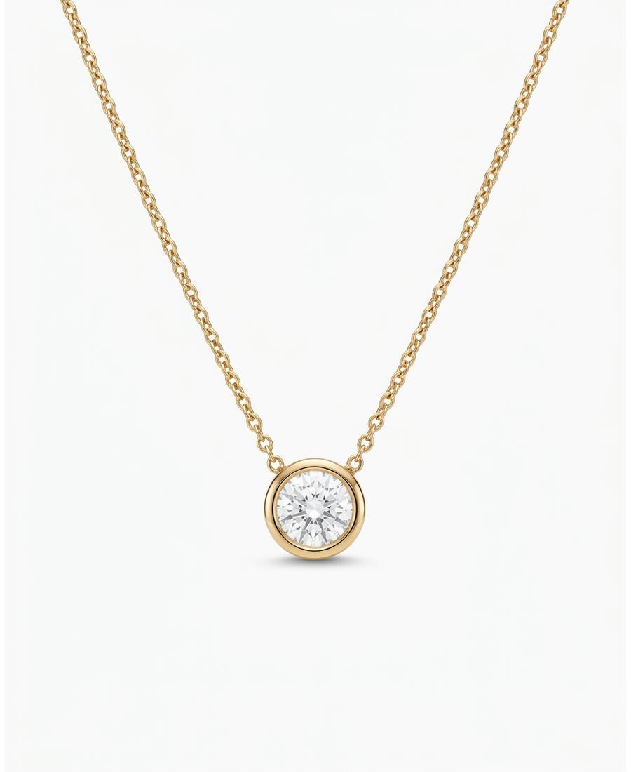 A fine solid-gold necklace with a small bezel-set gemstone pendant