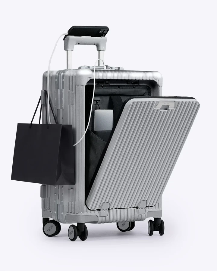 NOBL Carry-On front pocket open with a laptop
