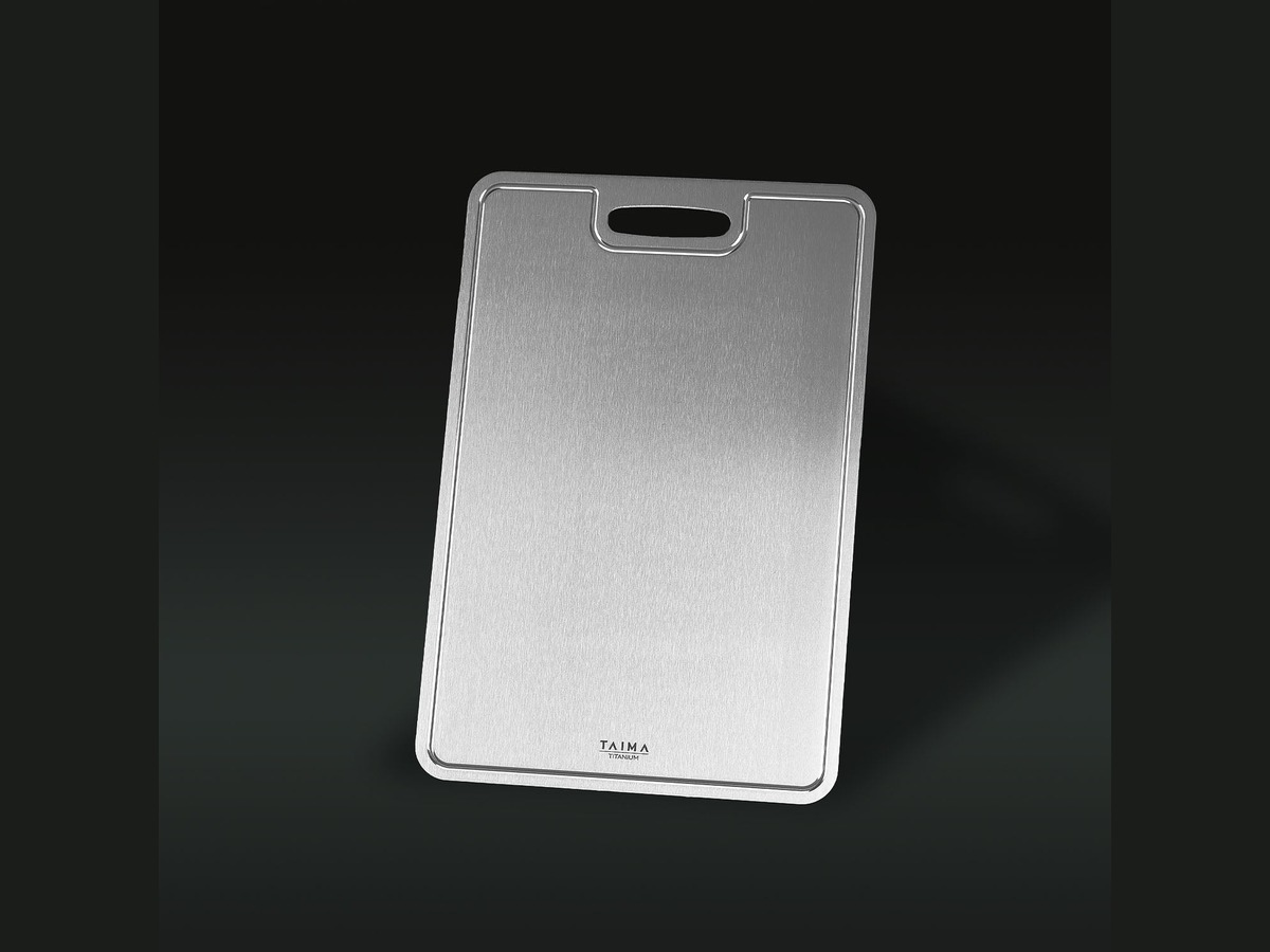 The Taima Pure Titanium Cutting Board standing upright