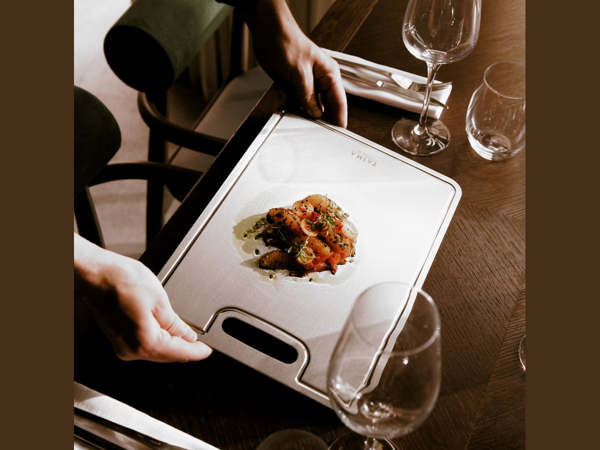 A plated dish served on the Taima titanium board