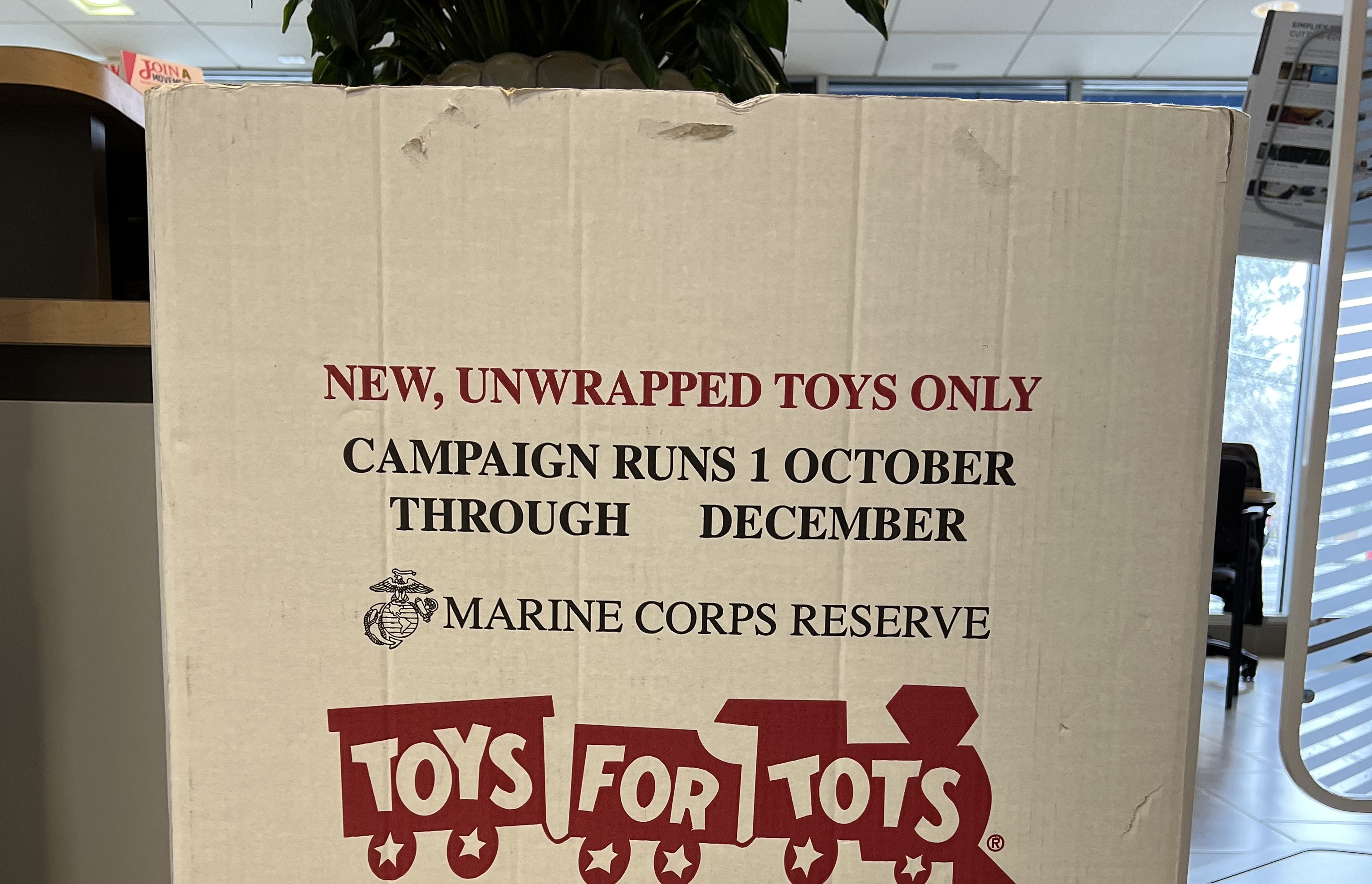 Toys For tots Box, words on it read New Unwrapped Toys Only, Campaign Runs 1 October through December