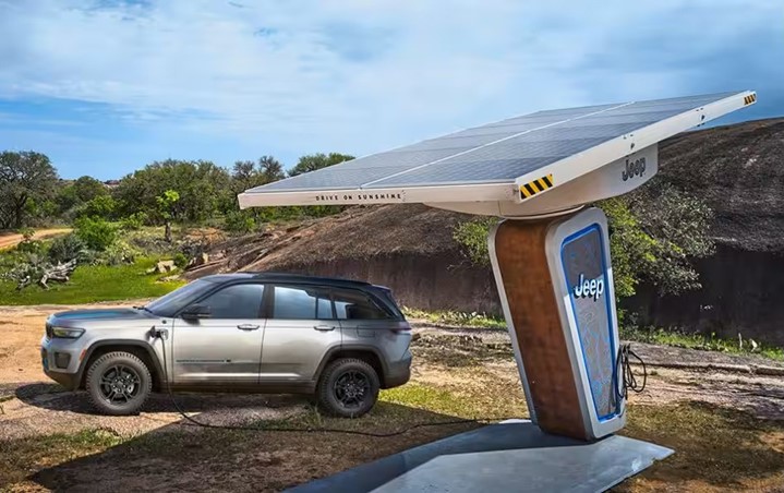 A silver SUV at a solar charging station.