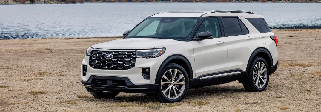 White 2025 Ford Explorer Side Exterior by a Lake