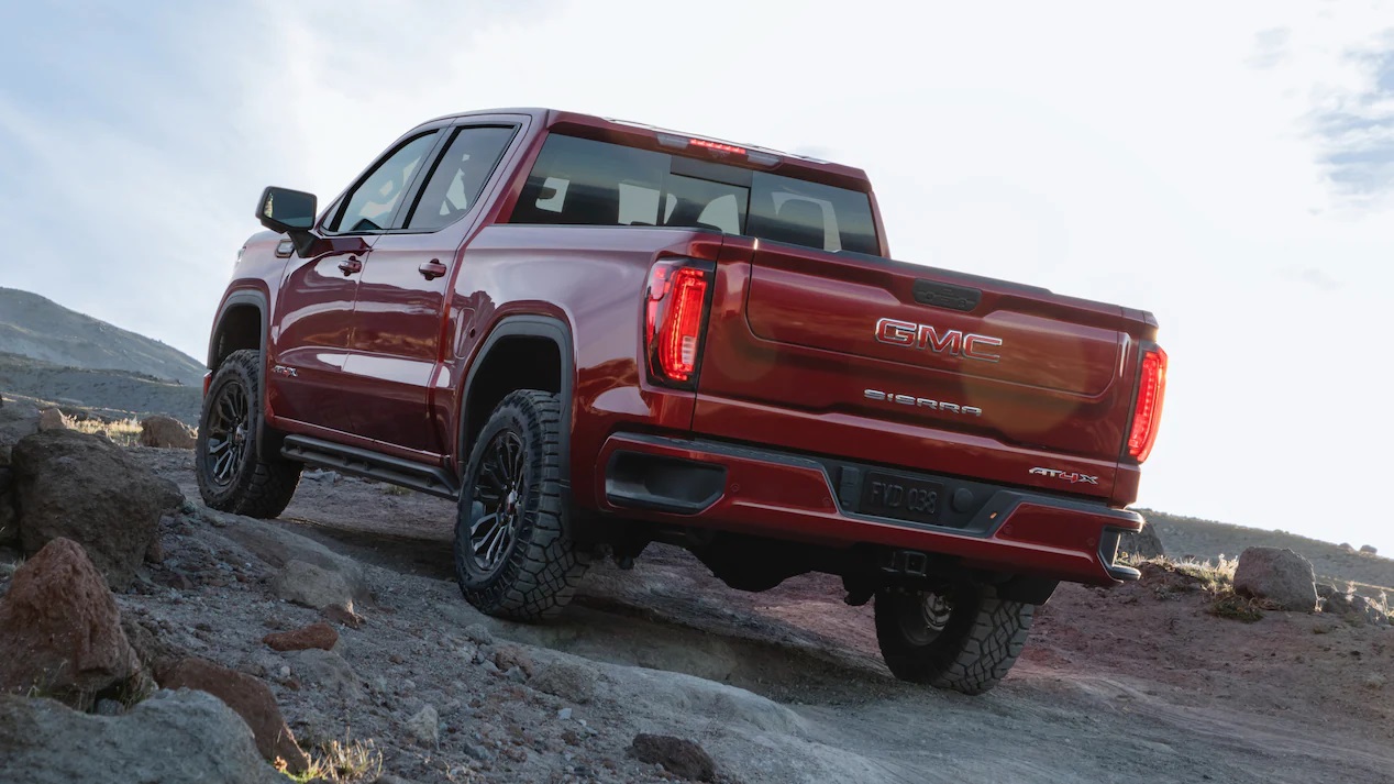 Back of red GMC sierra at4x off-roading