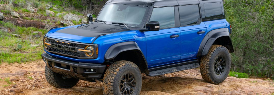Blue 2024 Ford Bronco Raptor on a Hill with Black Appearance Package