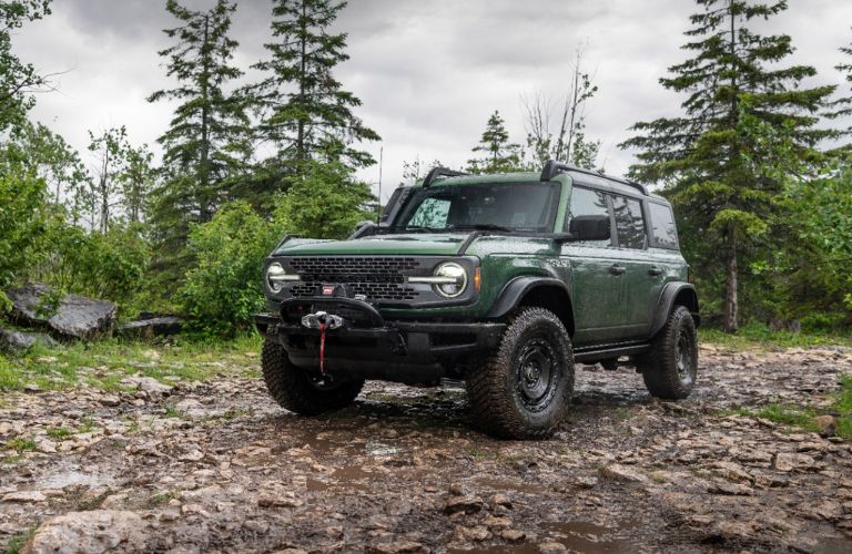 Green 2023 Ford Bronco Everglades Trim on a Muddy Trail