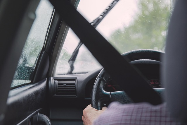 over the shoulder shot of steering wheel