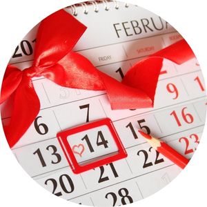 February 14th Circled on a Calendar with Red Ribbon