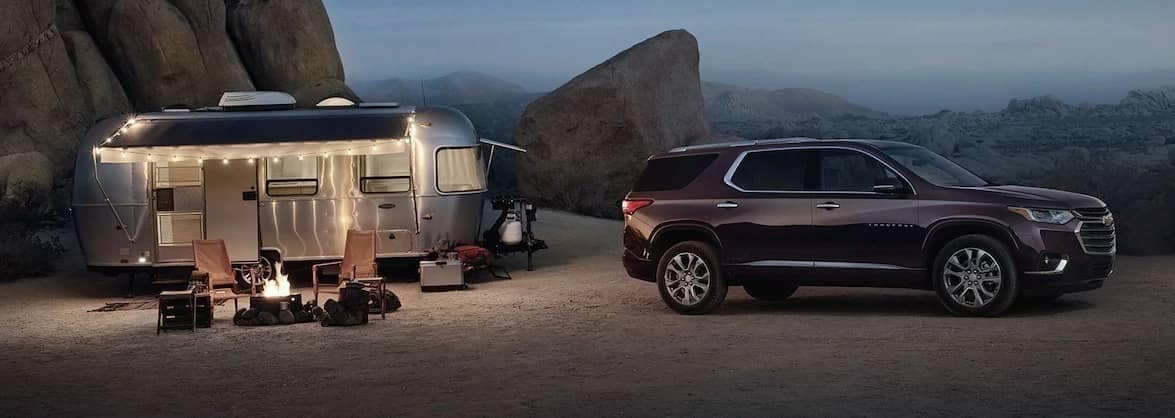 Traverse parked next to camper