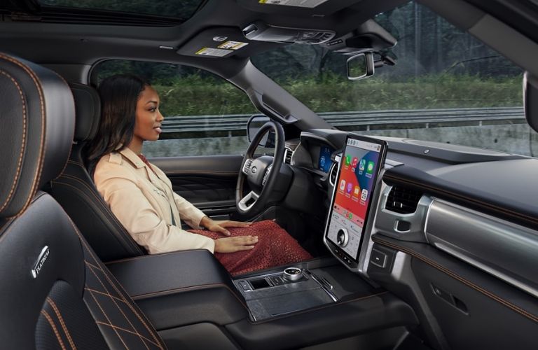 Woman in Front Seat of 2024 Ford Expedition Using Hands-Free Ford BlueCruise