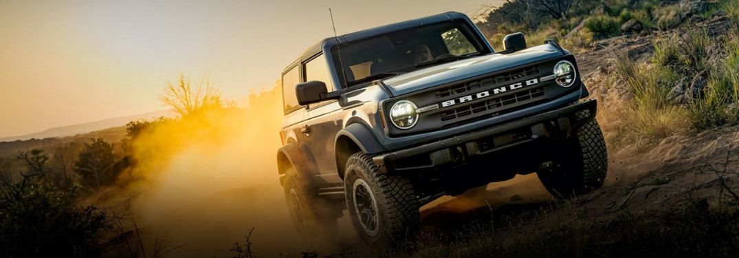 Gray 2023 Ford Bronco Front Grille on a Desert Trail at Sunset