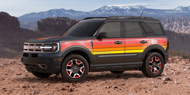 image of black with red orange and yellow stripes ford bronco sport free wheeling