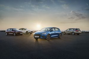 Global 2019 Ford Focus models parked together with a sunset in the background