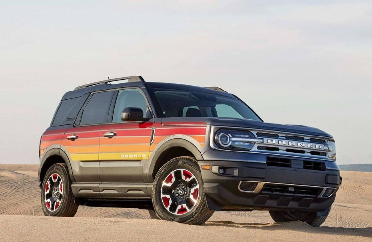 Black 2024 Ford Bronco Sport Freewheeling Edition with Sunset Exterior Graphics in the Desert