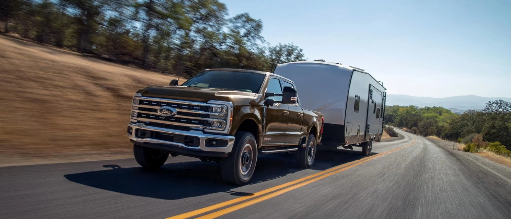 image of ford truck towing camper