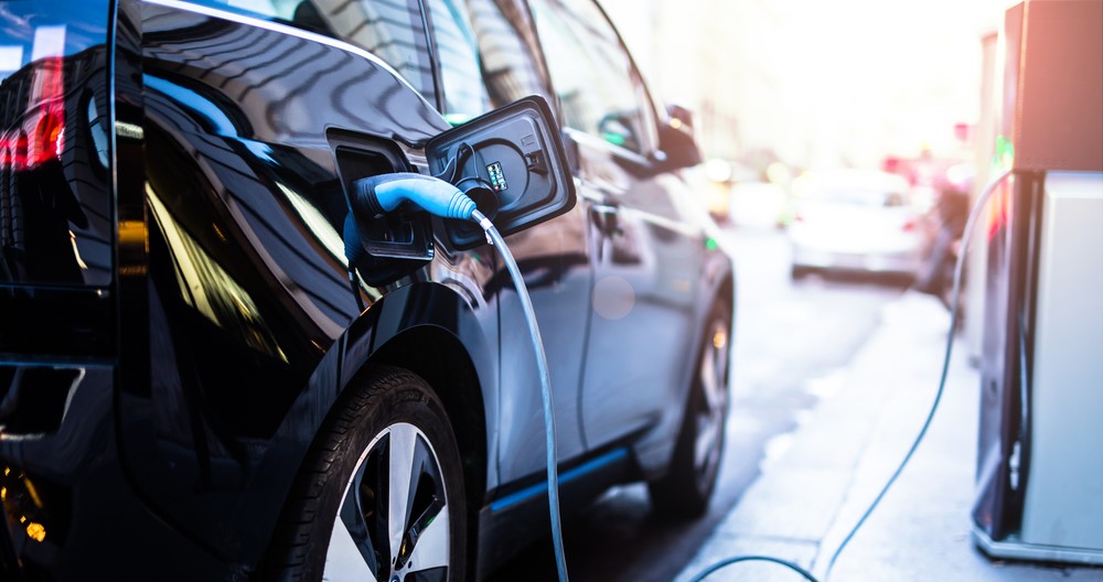 electric vehicle plugged into a charging station