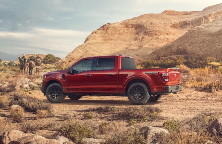 Red 2023 Ford F-150 Rattler Side Exterior in a Desert