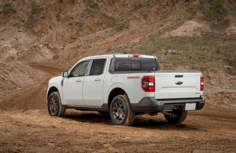 White 2023 Ford Maverick Tremor Rear Exterior on Dirt Trail