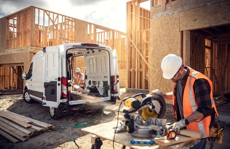 construction workers using power generator of the 2022 Ford E-Transit