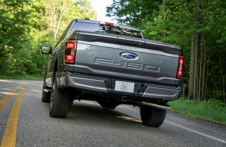 rear view of a black 2021 Ford F-150 Hybrid