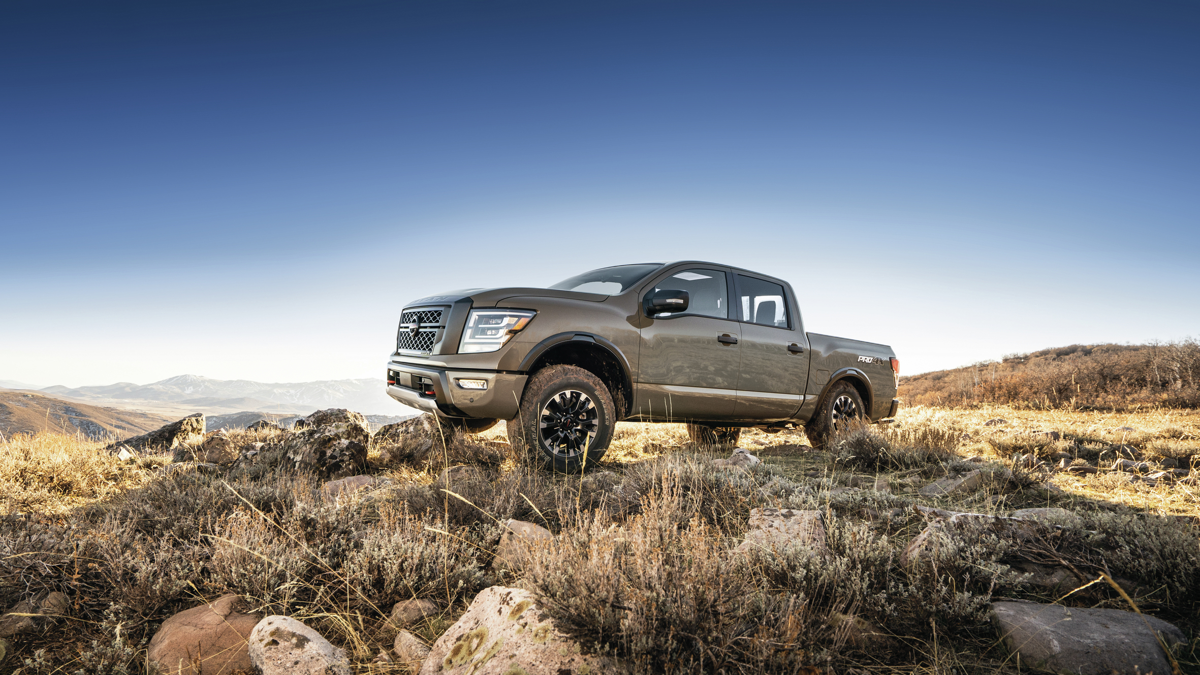 Nissan Titan going offroad on rocks and grass