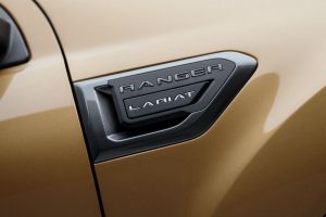 close up of the side Lariat logo on a gold 2019 Ford Ranger Lariat