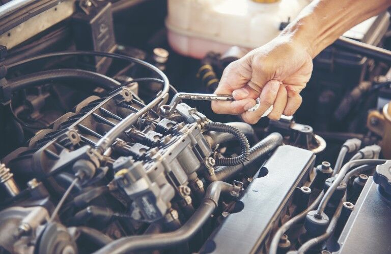 hand working on a motor