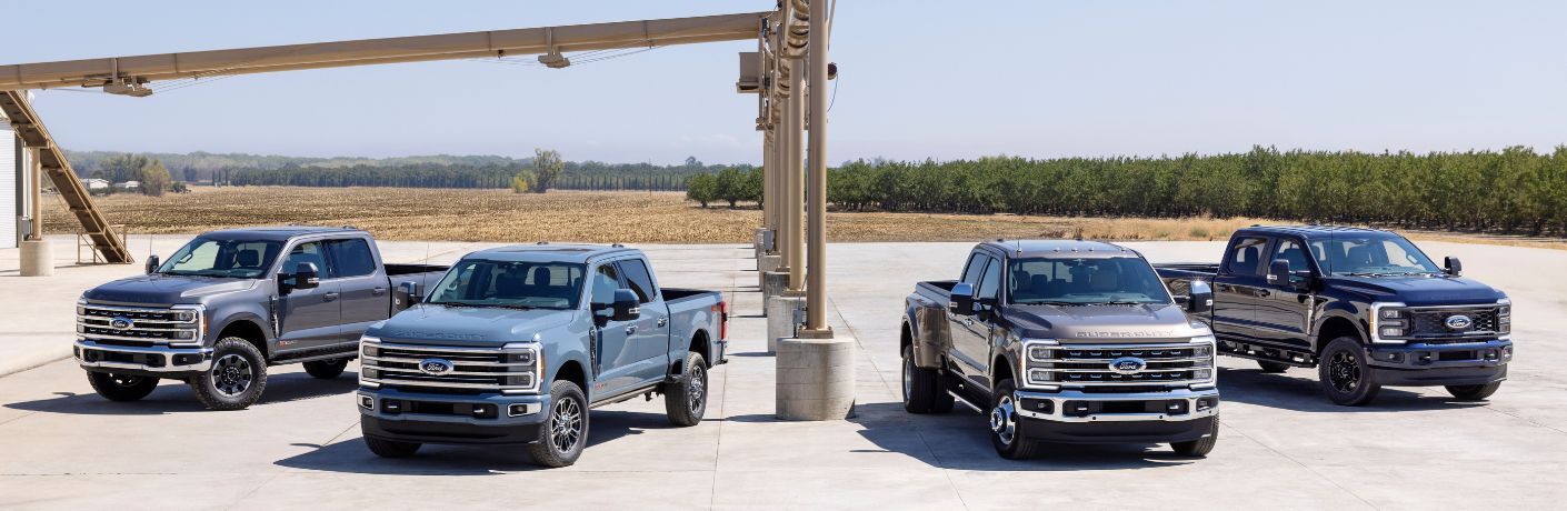 Four 2023 Ford Super Duty Models on a Jobsite