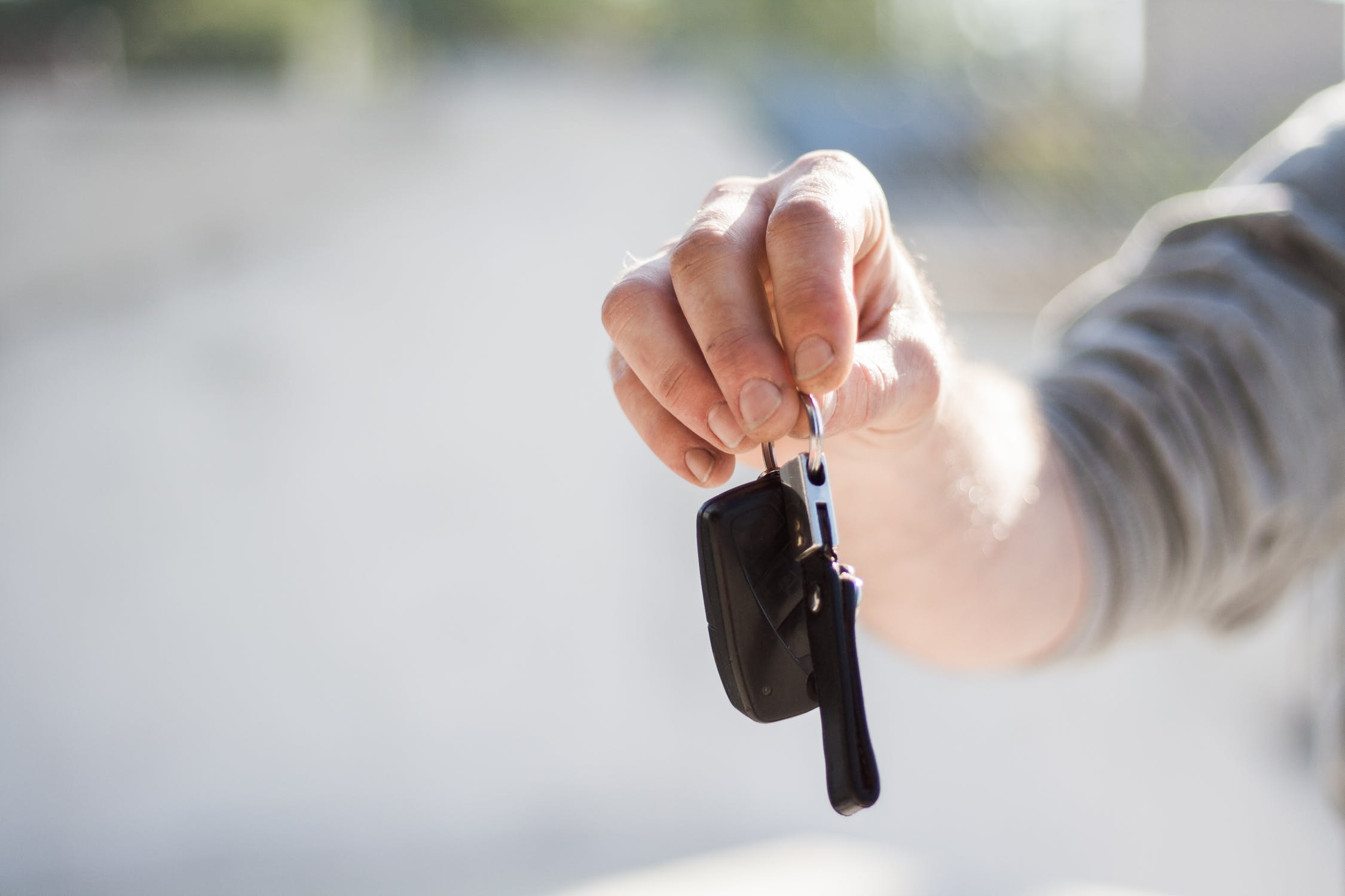 hand holding keys offering them to you