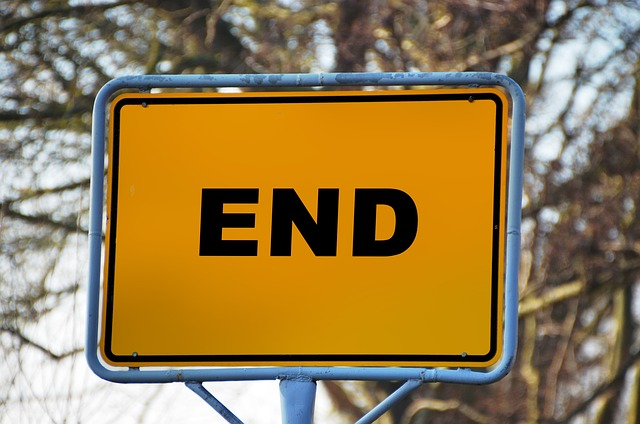 yellow sign that says end